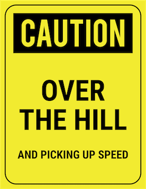 funny safety sign caution over the hill and picking up speed