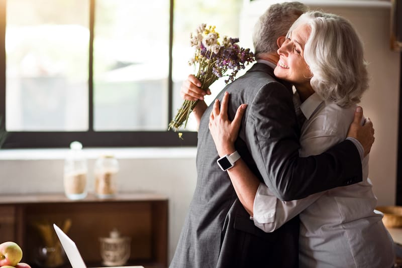 happy anniversary wishes elderly couple embracing